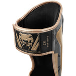 ESPINILLERAS VENUM ELITE - CAMO OSCURO/ORO