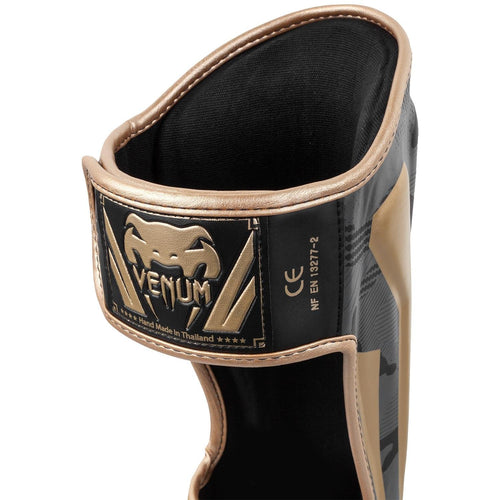 ESPINILLERAS VENUM ELITE - CAMO OSCURO/ORO