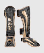 ESPINILLERAS VENUM ELITE - CAMO OSCURO/ORO