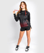 Sudadera con capucha Venum UFC Performance Institute - Para mujer - Negro/Rojo