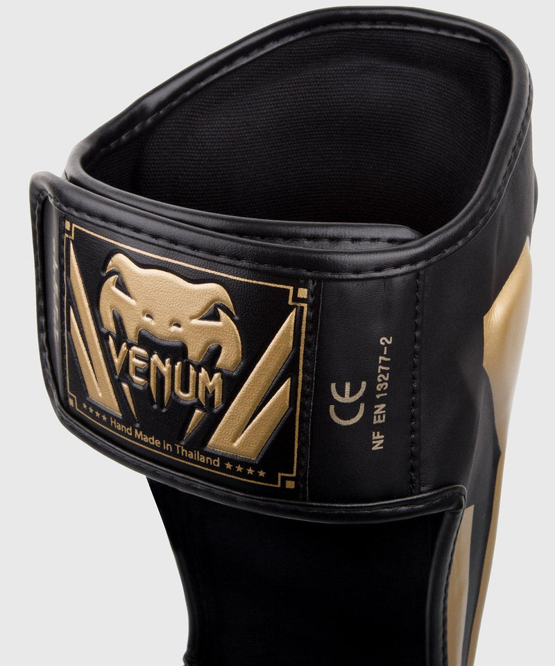 Espinilleras Venum Elite Standup - Negro/Oro Foto 3